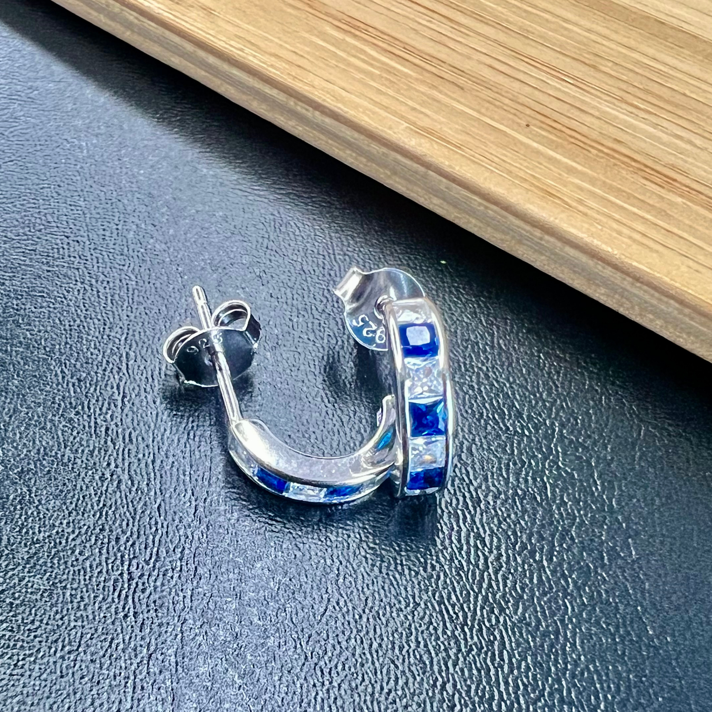 Sterling Silver Blue Half-hoop CZ Clear Studs Earrings