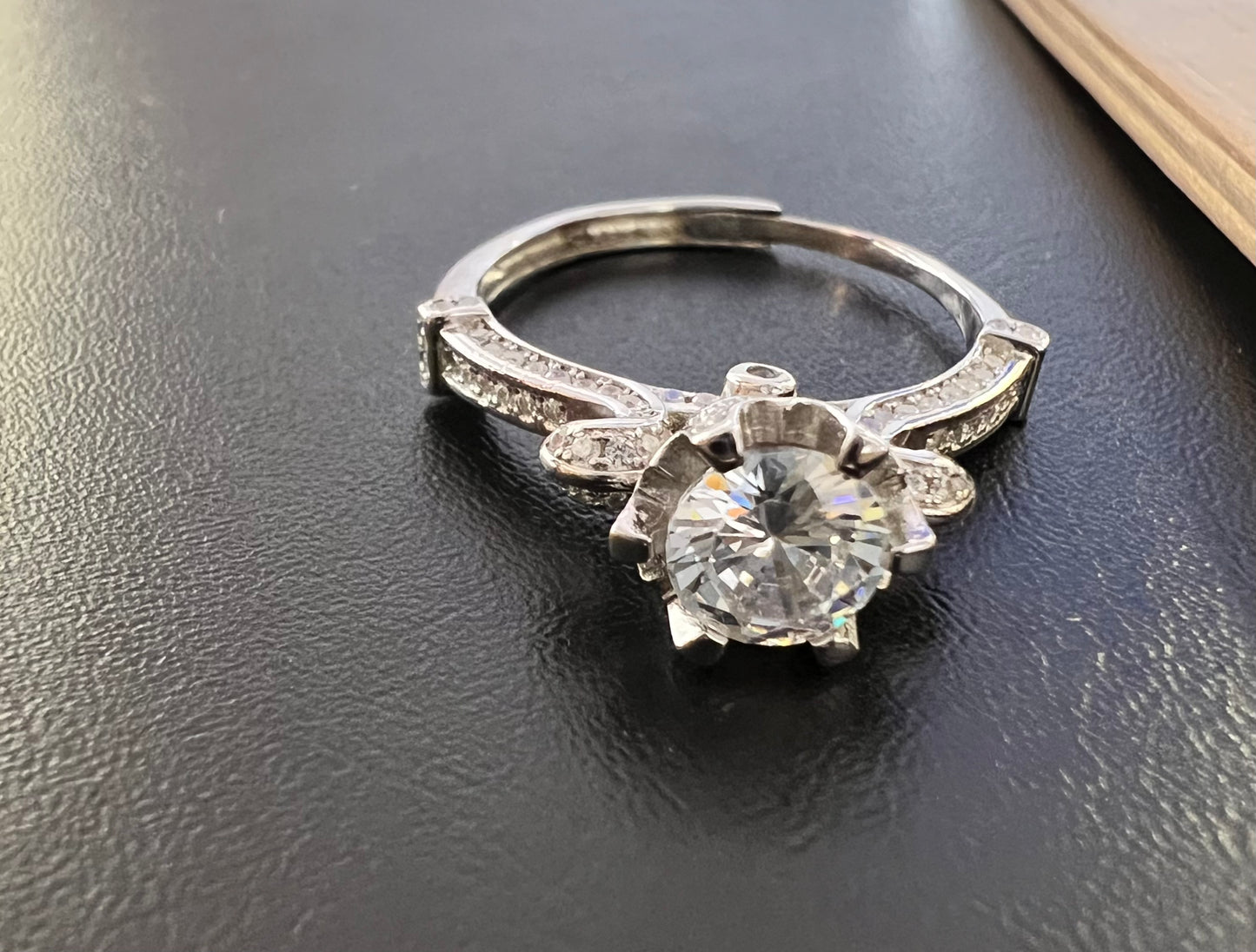 Sterling Silver Flexible Solitaire Engagement Ring with curved shoulders